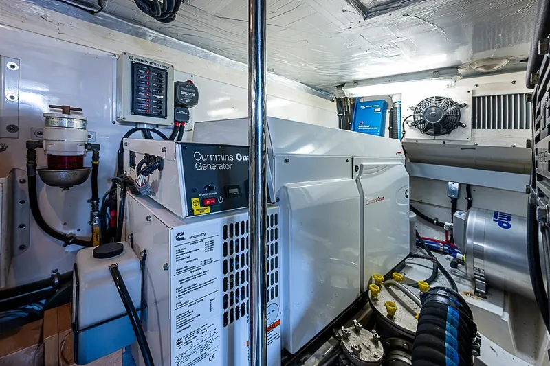 Slide: The Image of Engine room of 2009 Riviera 58 Flybridge with Cummins Onan generator. - 52