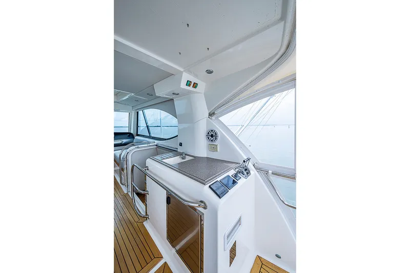 Slide: The Image of 2009 Riviera 58 Flybridge interior with sleek design and modern controls. - 68