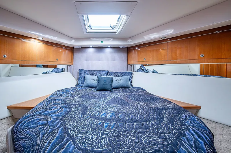 Slide: The Image of Luxurious bedroom interior of 2009 Riviera 58 Flybridge yacht with elegant bedding. - 45