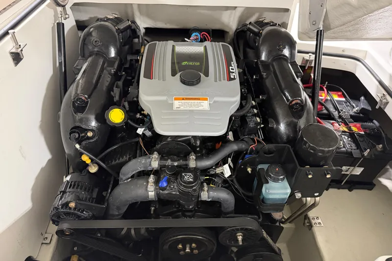 Slide: The Image of Engine compartment of a 2013 Cobalt 220 boat, featuring a 5.0L engine. - 16