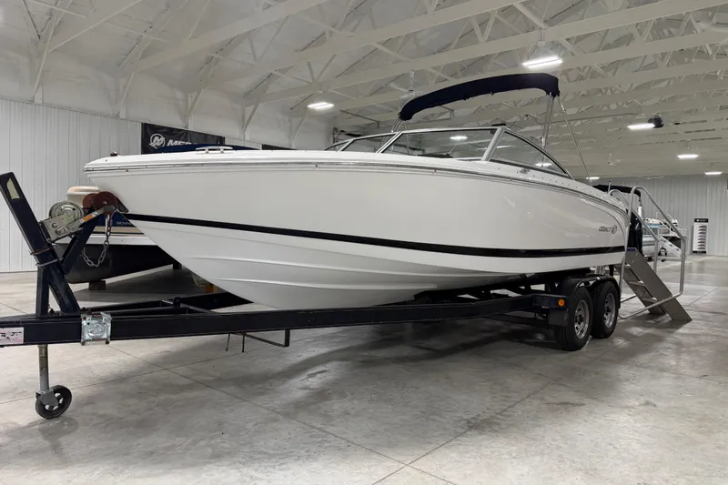 Slide: The Image of 2013 Cobalt 220 boat on trailer in indoor showroom setting. - 15
