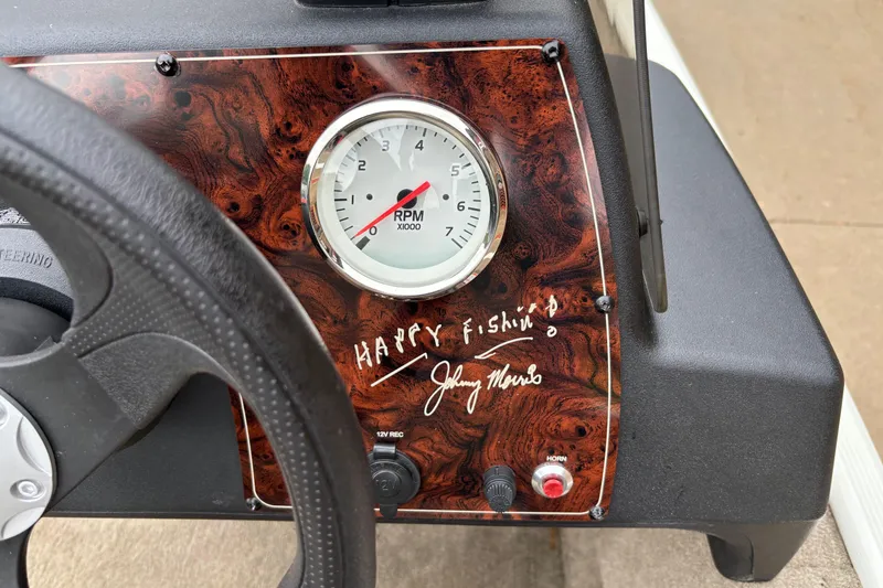 Slide: The Image of 2022 Tracker Bass Tracker Classic XL dashboard with RPM gauge and "Happy Fishing" signature. - 10