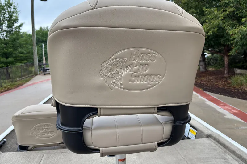 Slide: The Image of Bass Tracker Classic XL 2022 boat seat with Bass Pro Shops logo, outdoors. - 12