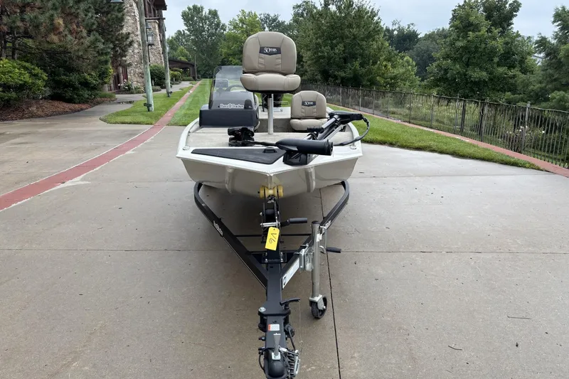 Slide: The Image of 2022 Tracker Bass Tracker Classic XL boat on trailer, parked on driveway. - 2