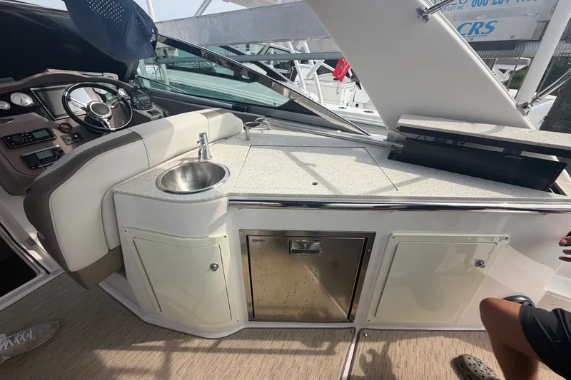 Slide: The Image of Interior view of a 2017 Regal 32 Express yacht with sink and control panel. - 5