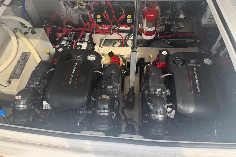 Slide: The Image of The engine compartment of a 2017 Regal 32 Express features two Volvo Penta engines. - 32