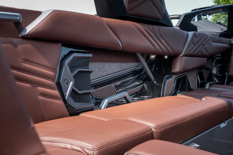 Slide: The Image of Luxurious brown leather seating in the 2026 Tigé Ultré 25ZX boat interior. - 25