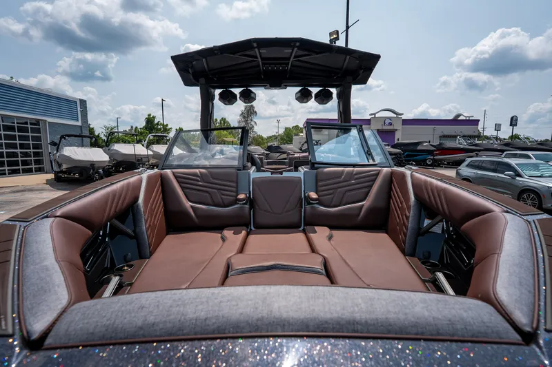 Slide: The Image of 2026 Tigé Ultré 25ZX boat interior with luxurious brown seating and modern design. - 31