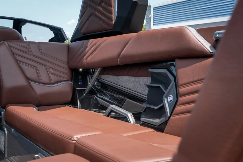 Slide: The Image of 2026 Tigé Ultré 25ZX interior with luxurious brown leather seating and modern design elements. - 24