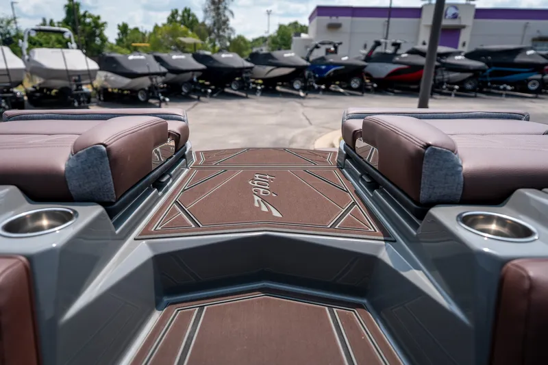 Slide: The Image of 2026 Tigé Ultré 25ZX boat interior with cushioned seating and sleek design. - 50