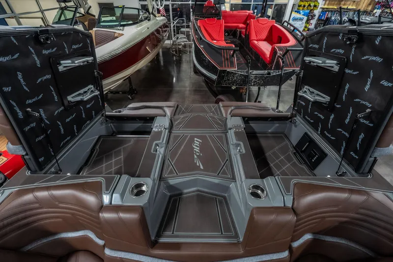 Slide: The Image of 2026 Tigé Ultré 25ZX boat interior with luxurious seating and storage compartments. - 23