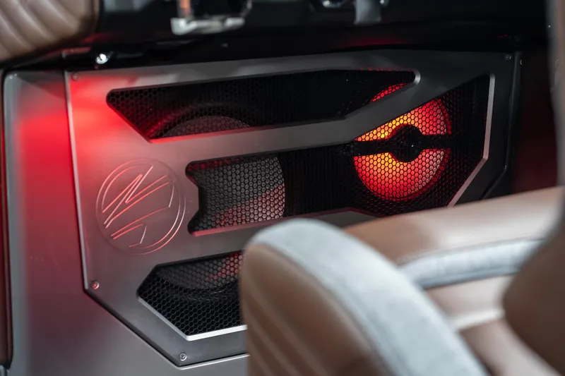 Slide: The Image of 2026 Tigé Ultré 25ZX interior speaker with red ambient lighting. - 33