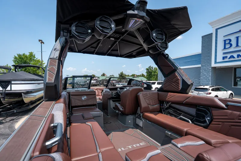 Slide: The Image of 2026 Tigé Ultré 25ZX boat interior with luxurious seating and advanced audio system. - 23