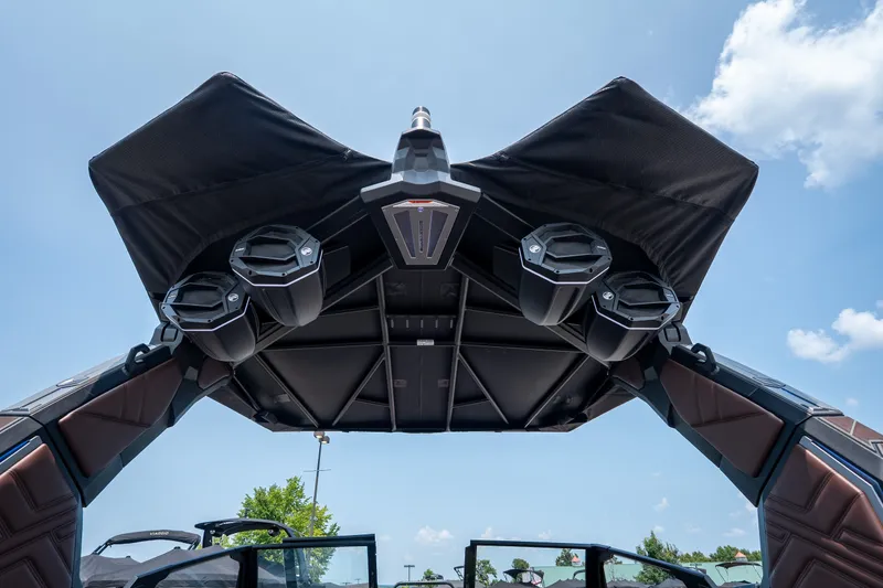 Slide: The Image of 2026 Tigé Ultré 25ZX boat tower with speakers under a clear blue sky. - 27