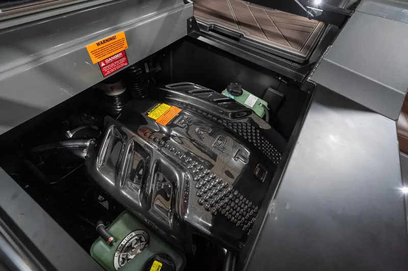 Slide: The Image of Engine compartment of 2026 Tigé Ultré 25ZX boat, showcasing advanced mechanical components. - 25