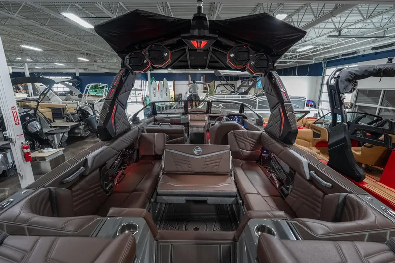Slide: The Image of 2026 Tigé Ultré 25ZX boat interior with luxurious seating and advanced audio system. - 8