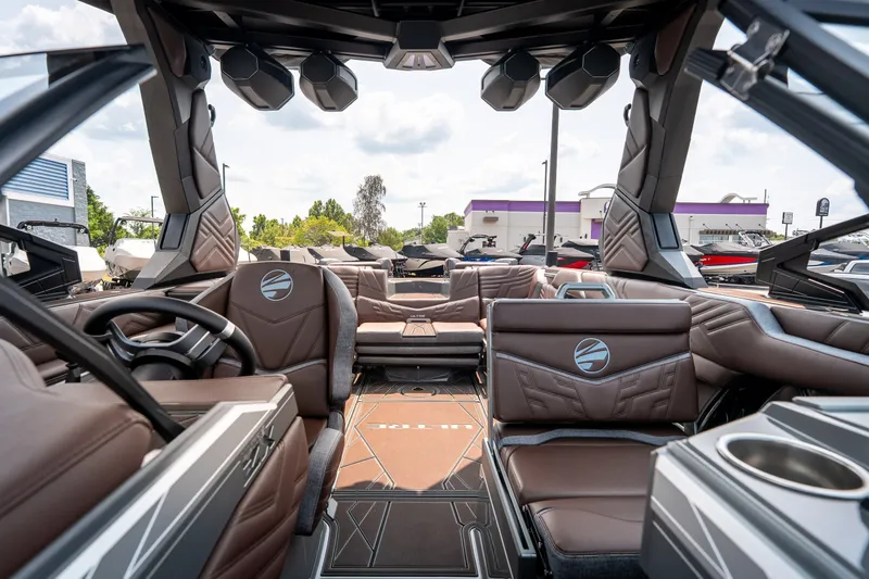 Slide: The Image of 2026 Tigé Ultré 25ZX boat interior with luxurious brown seating and modern design. - 32