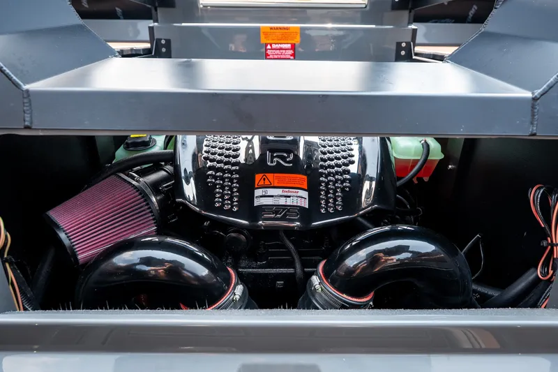 Slide: The Image of 2026 Tigé Ultré 25ZX engine compartment with visible components and wiring. - 48