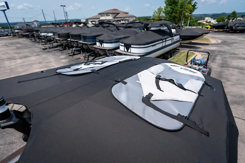 Slide: The Image of 2026 Tigé Ultré 25ZX boats covered in a dealership lot, ready for sale. - 39