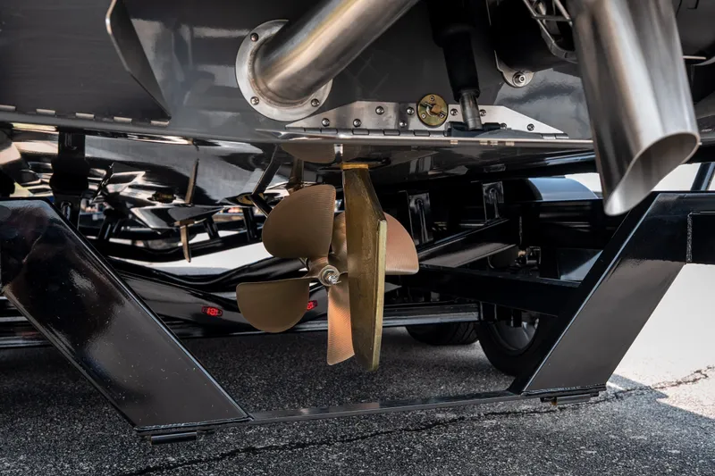 Slide: The Image of Close-up of 2026 Tigé Ultré 25ZX boat propeller and exhaust system. - 11