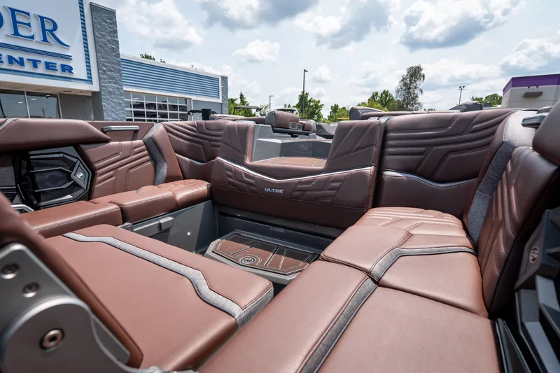Slide: The Image of Interior of 2026 Tigé Ultré 25ZX boat with luxurious brown seating and modern design. - 42