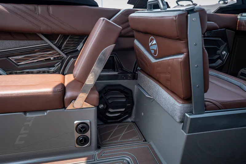 Slide: The Image of 2026 Tigé Ultré 25ZX interior with brown leather seats and modern design elements. - 51