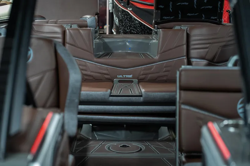 Slide: The Image of Luxurious interior of 2026 Tigé Ultré 25ZX boat with brown leather seating. - 20