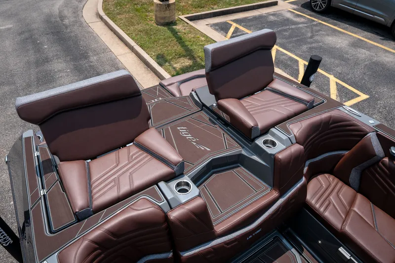Slide: The Image of 2026 Tigé Ultré 25ZX boat interior with luxurious brown seating and modern design. - 44