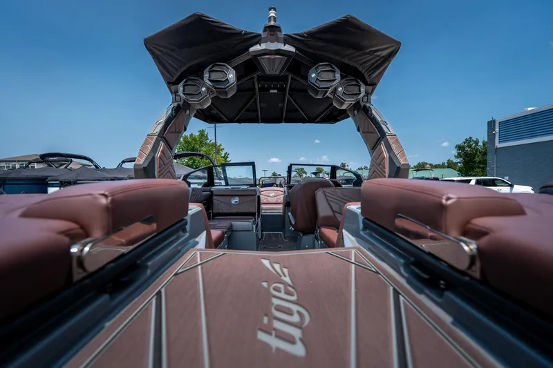 Slide: The Image of 2026 Tigé Ultré 25ZX boat interior with luxurious seating and advanced sound system. - 20