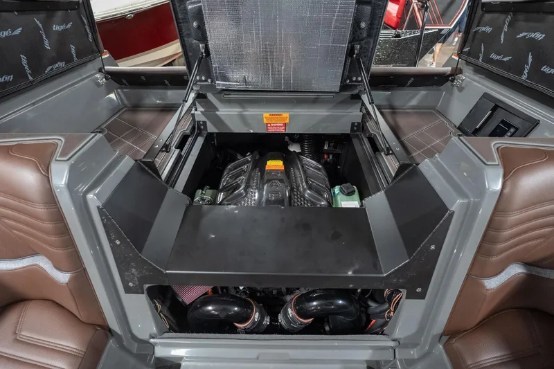 Slide: The Image of Engine compartment of 2026 Tigé Ultré 25ZX boat, showcasing modern design and components. - 24