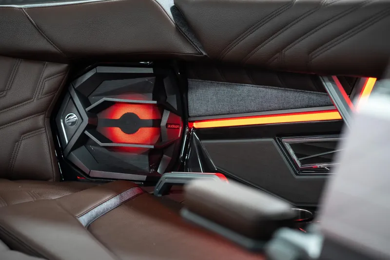 Slide: The Image of Interior of 2026 Tigé Ultré 25ZX with illuminated speaker and luxurious seating. - 16