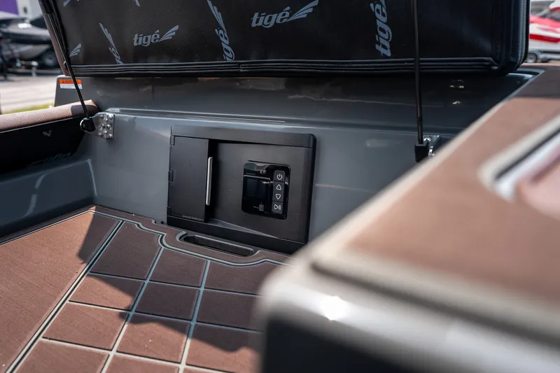 Slide: The Image of 2026 Tigé Ultré 25ZX boat interior with advanced control panel and sleek design. - 47
