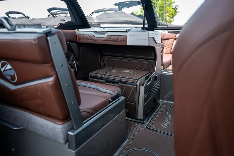 Slide: The Image of Interior of 2026 Tigé Ultré 25ZX boat with luxurious brown seating and modern design. - 52