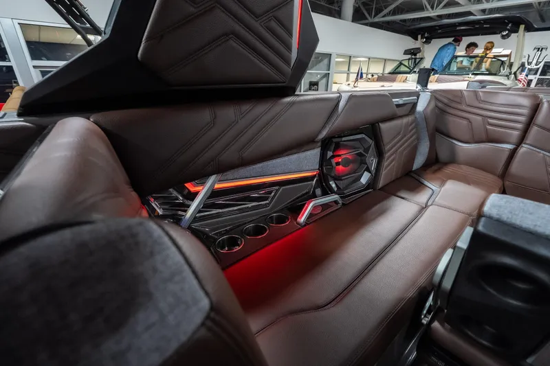 Slide: The Image of Luxurious interior of 2026 Tigé Ultré 25ZX boat with brown leather seating and ambient lighting. - 22