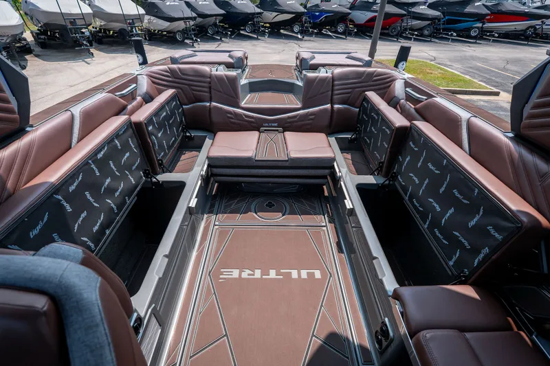Slide: The Image of Luxurious interior of 2026 Tigé Ultré 25ZX boat with brown leather seating. - 37