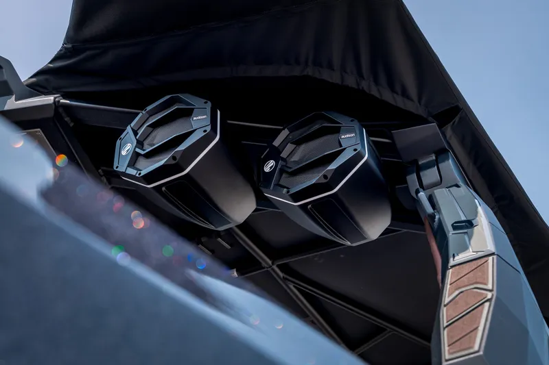 Slide: The Image of 2026 Tigé Ultré 25ZX boat speakers under canopy, showcasing modern audio technology. - 17