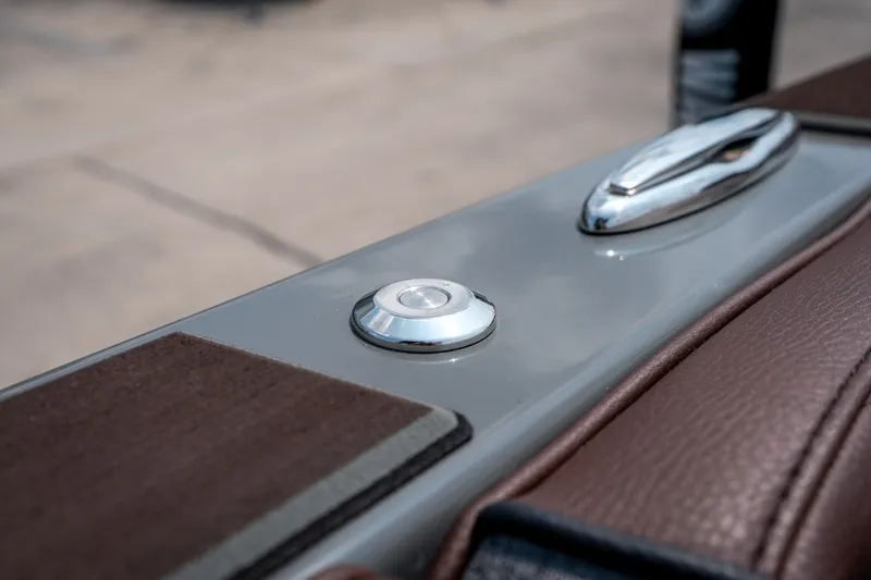 Slide: The Image of Close-up of 2026 Tigé Ultré 25ZX boat detail, featuring sleek chrome and leather accents. - 40
