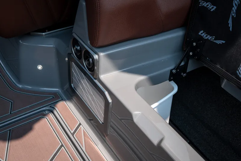 Slide: The Image of 2026 Tigé Ultré 25ZX interior detail with brown seating and modern design elements. - 38