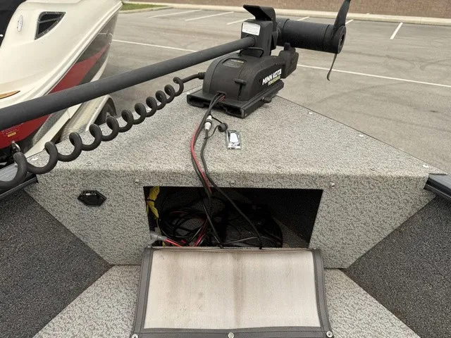 Slide: The Image of A 2022 Lund 1650 Rebel XL SS with a Minn Kota trolling motor on the deck. - 17