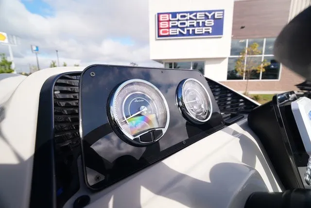 Slide: The Image of Close-up of a Barletta A24UC boat dashboard with speedometer and tachometer. - 21