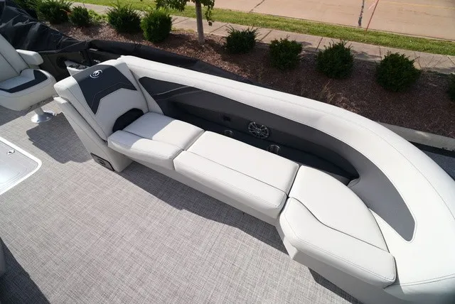 Slide: The Image of The image shows a sleek white seating area on a boat, surrounded by gray carpeting. - 30