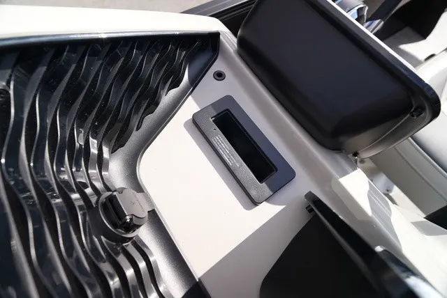 Slide: The Image of Close-up of a Barletta A24UC boat showing storage compartment with black insert. - 36