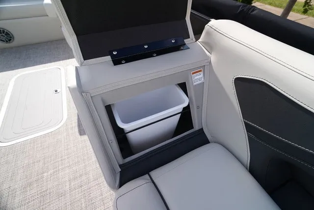 Slide: The Image of A sleek seating area with an integrated trash bin in a Barletta A24UC boat. - 31