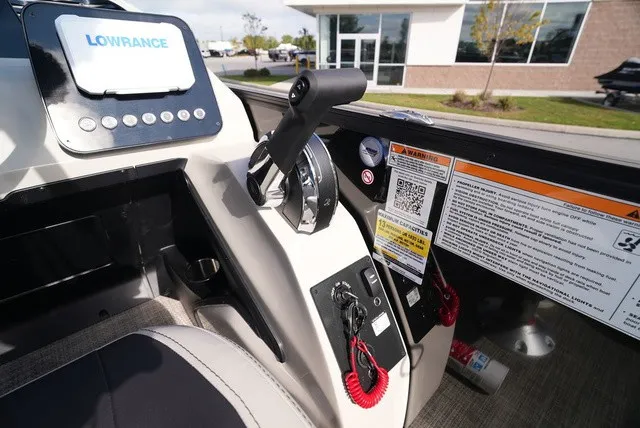 Slide: The Image of The image shows the cockpit of a Barletta A24UC boat with controls and instruments. - 23