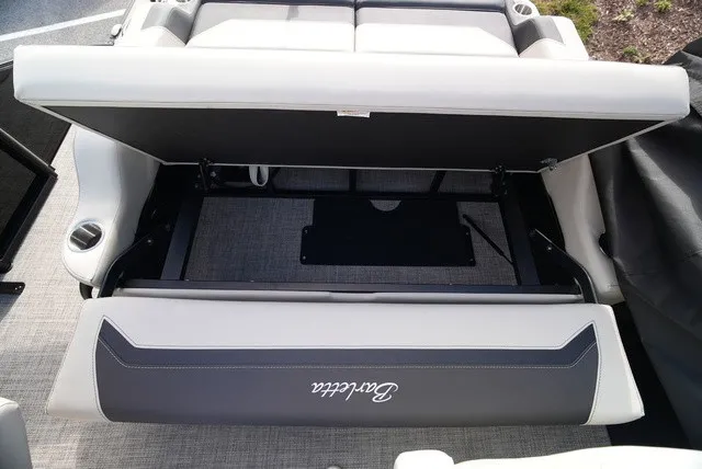 Slide: The Image of A Barletta boat with a lifted seat revealing storage space underneath. - 17