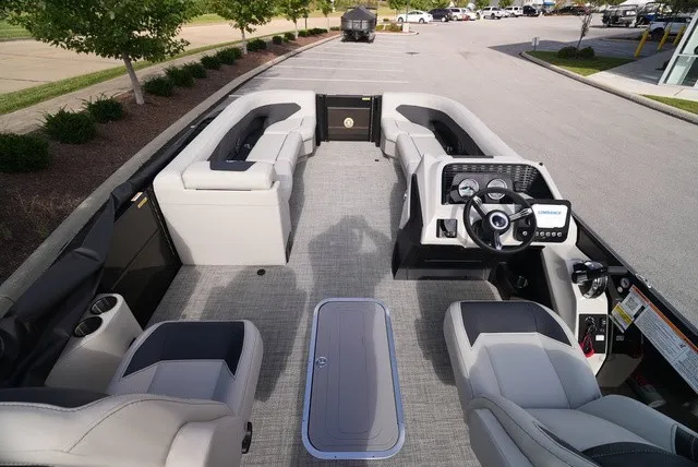 Slide: The Image of The image shows the interior of a 2027 Barletta A24UC boat with modern seating and a helm station. - 18