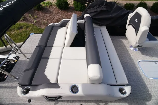 Slide: The Image of The image shows the deck of a Barletta A24UC boat with gray and white upholstery. - 16
