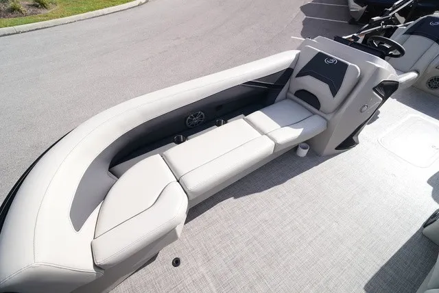 Slide: The Image of The image shows a sleek, cushioned seating area on a boat, surrounded by a clean deck. - 34
