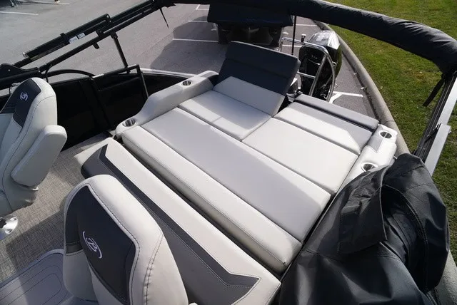 Slide: The Image of The image shows the deck of a Barletta A24UC boat with gray upholstery and seating. - 15