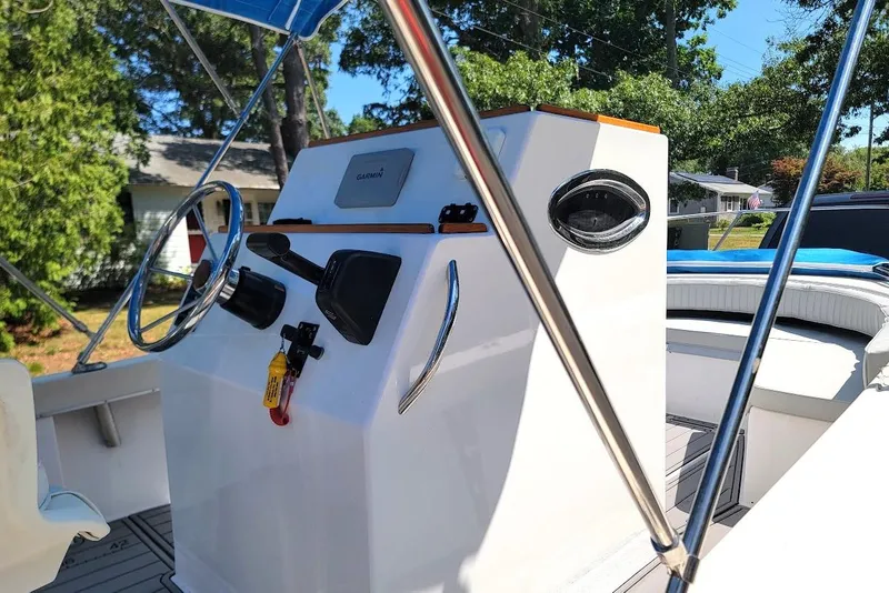 Slide: The Image of 1978 Wellcraft V-20 Steplift boat interior with steering wheel and navigation equipment. - 8